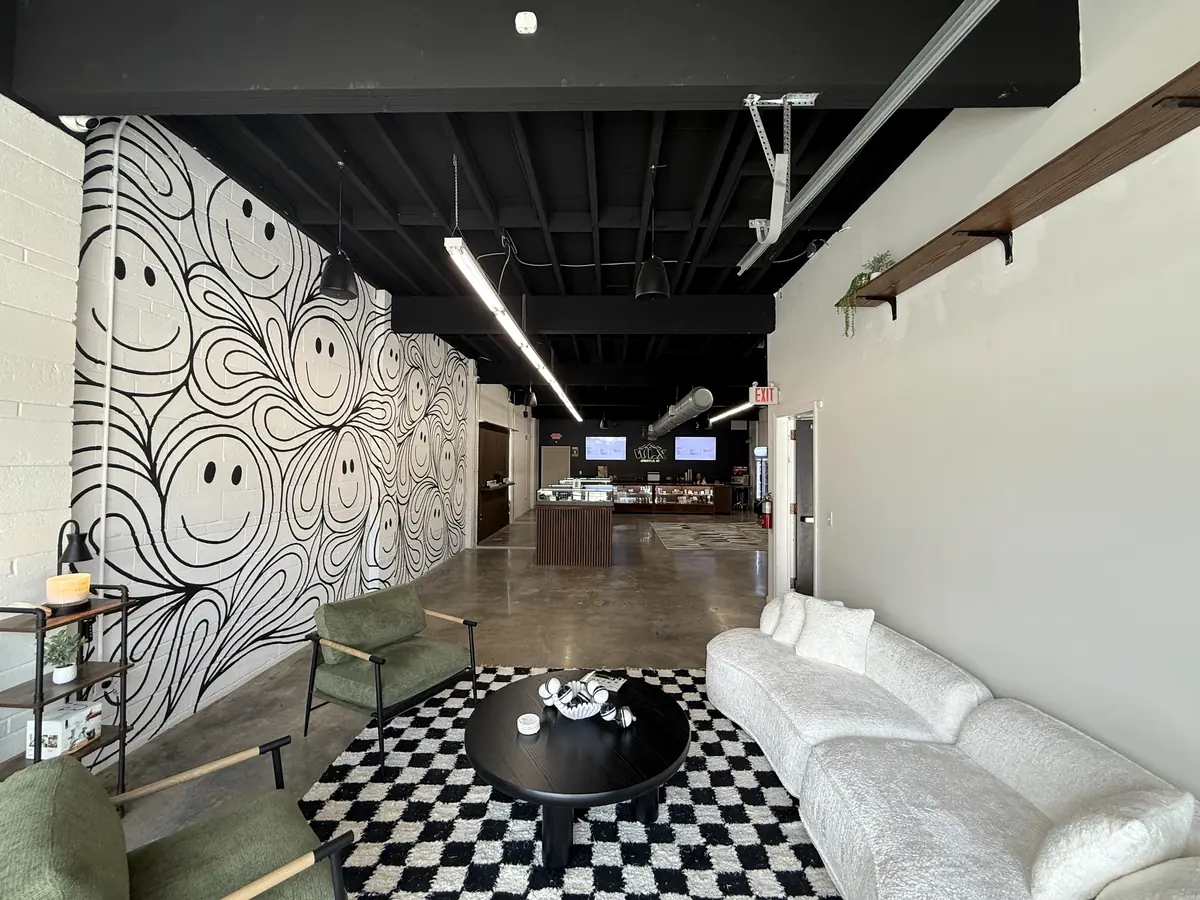 The seating area at White Label Exotics, where customers wait with their phones before going to the counter.
